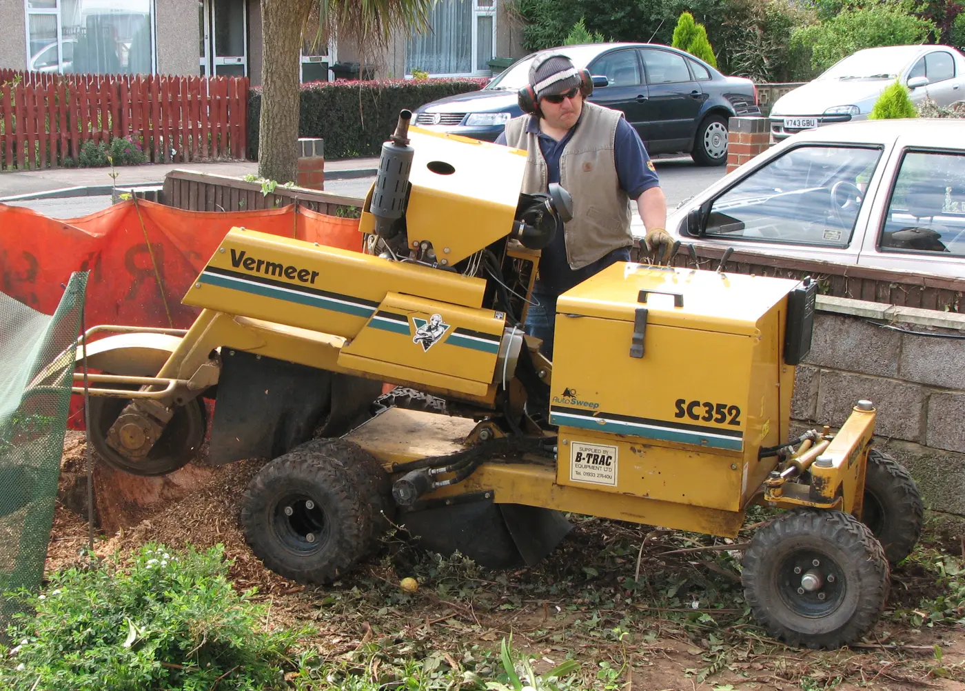 A stump grinder working at a property